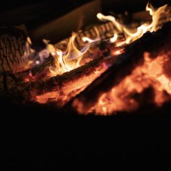 Close up of Logs Burning in Celeste Fire Pit at night - Firepits UK - SQR - LoRes123