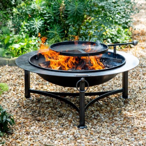 Saturn fire pit with Swing Arm BBQ Rack lit on gravel - Lifestyle - Firepits UK - LoRes600x600 329
