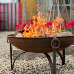 Plain Jane Fire Pit Lifestyle Rusted - Close Up with Tulips - FirepitsUK - WEB - Lo Res