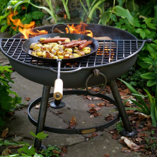 Classic Fire Pit Lit with Half Moon BBQ Rack and Long Handled Pan Lifestyle - Firepits UK - WEB - Lo Res