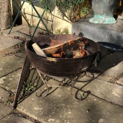 Indian Fire Bowl 70 with Half Moon BBQ Rack Lit Lifestyle - Firepits UK - WEB - Lo Res