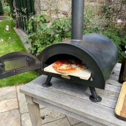 Table Top Pizza Oven Fire Pit with cooked pizza Lifestyle - Firepits UK - WEB - Lo Res2