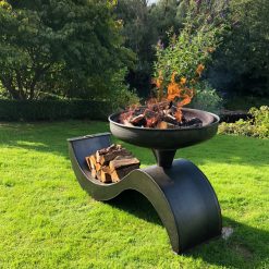 The Wave 70 Fire Pit Lit with Logs Side Angle Lifestyle - FirepitsUK - WEB - Lo Res