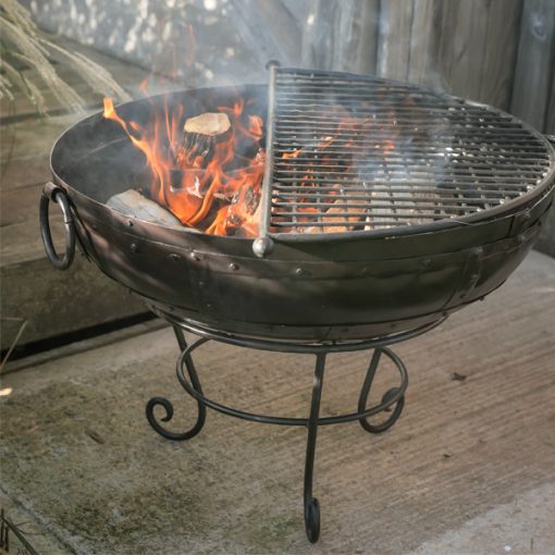 Indian Fire Bowl Fire Pit - Lifestyle lit with BBQ Rack central - Firepits UK - WEB - Lo Res