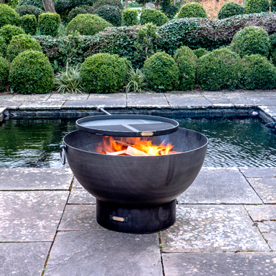 Solex Fire Pit with Swing Arm BBQ Rack on Patio Lifestyle - Firepits UK - WEB - Lo Res