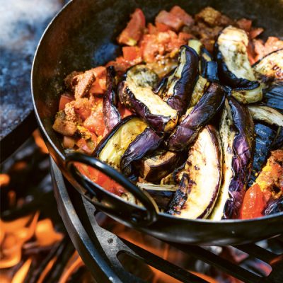 Lamb and Beef Curry on Swing Arm in Cooking Bowl from Genevieve Taylor's Seared - Firepits UK - LoRes 600x600