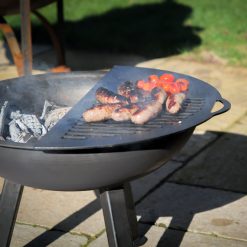 TriPit Fire Pit Lit Close Up of Sausages on BBQ Rack on Patio Lifestyle - Firepits UK - LoRes 3