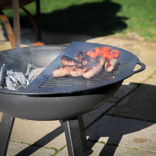 TriPit Fire Pit Lit Close Up of Sausages on BBQ Rack on Patio Lifestyle - Firepits UK - LoRes 3