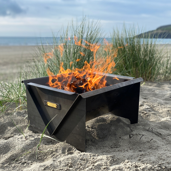 Flat Pack Fire Pit - Lifestyle on Beach - Firepits UK - WEB 600x600 - Lo Res