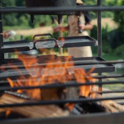 Asado Doble BBQ - Lifestyle with adjustable grills close up lit - Firepits UK - WEB 600x600 - Lo Res -Portico Grill