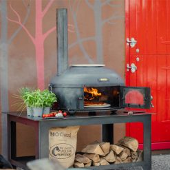 outdoor oven lit cooking pizza as part of our outdoor kitchen range uk