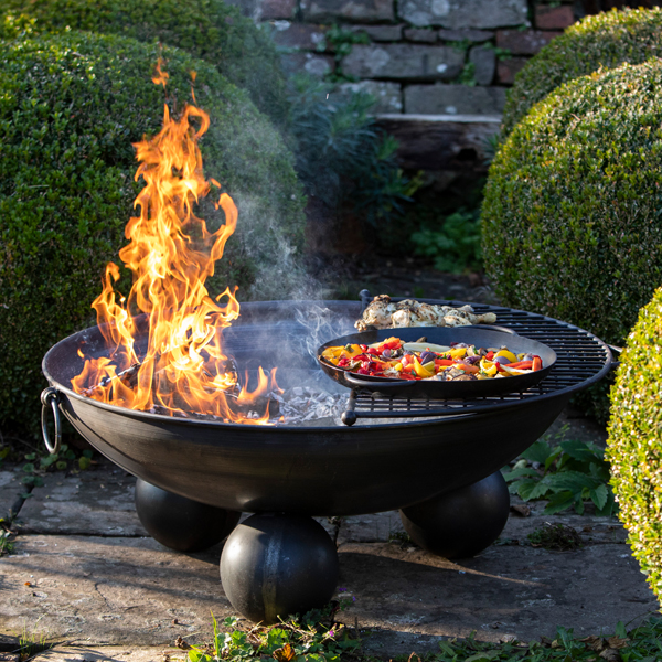 Top Tips - Ball Stand Fire Pit Lit with Half Moon Mesh BBQ Rack and Vegetables at Trostrey - Firepits UK - LoRes600x60053