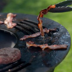 Bacon on sizzler ring roasting - cooking fire pit