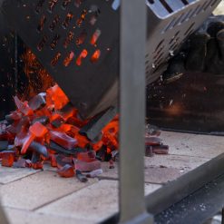 Charcoal Chimney Starter being emptied of lit coals - Lifestyle - Firepits UK - WEB 600x600 - Lo Res